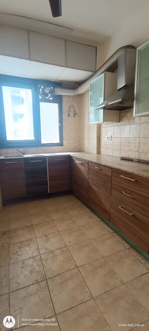 Kitchen in 2 BHK Apartment at Eros Kenwood Tower, Charmwood Village – for Sale