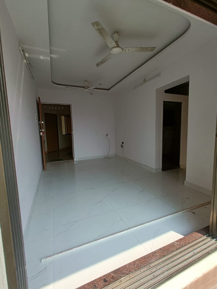 Living Room, shree-ostwal-orchid-building-no-9-to-12 1 Bedroom 695 Sq.Ft. Apartment In Mira Road Thane 8442864