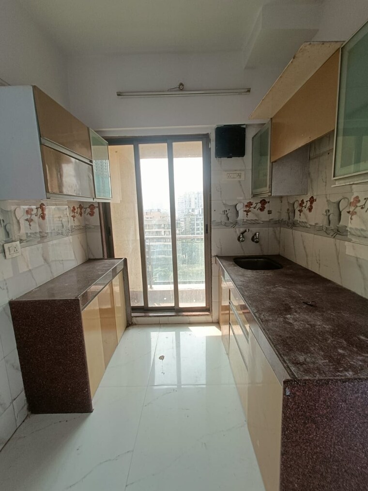 Kitchen, shree-ostwal-orchid-building-no-9-to-12 1 Bedroom 695 Sq.Ft. Apartment In Mira Road Thane 8442864
