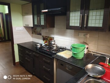 Kitchen in 4 BHK Apartment at Aratt Royal Manor, Hsr Layout – for Rent