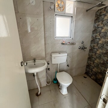 Bathroom in 2 BHK Apartment at Signature Global The Millennia, Garoli Kalan – for Rent