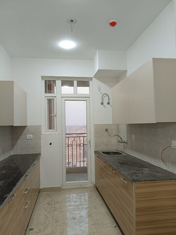 Kitchen in 4 BHK Apartment at Kbnows Apartment, Sector 16 Greater Noida – for Rent