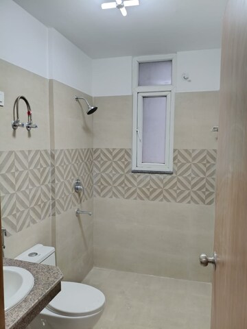 Bathroom in 4 BHK Apartment at Kbnows Apartment, Sector 16 Greater Noida – for Rent