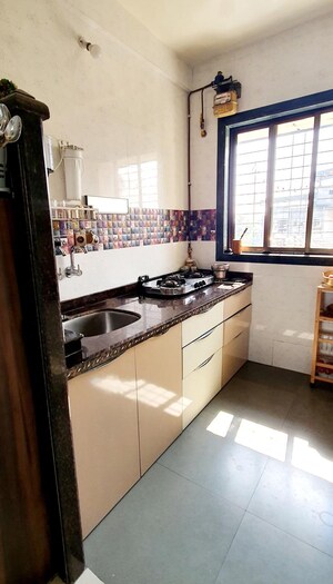 Kitchen in 3 BHK Penthouse at Simran Society, Naupada – for Sale
