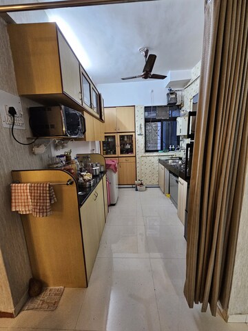 Kitchen in 2 BHK Apartment at Aakanksha Garden, Manpada – for Sale