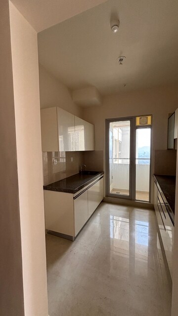 Kitchen in 2 BHK Apartment at Piramal Vaikunth, Balkum Pada – for Rent