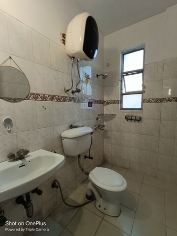 Bathroom in 1 RK Apartment at Maple Heights, Sector 43 – for Rent