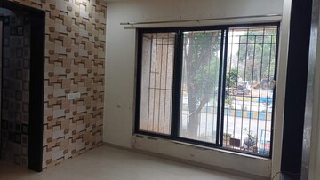Living Room in 1 BHK Apartment at Raunak Unnathi Greens, Kasarvadavali – for Sale
