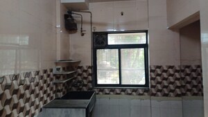 Kitchen in 1 BHK Apartment at Raunak Unnathi Greens, Kasarvadavali – for Sale