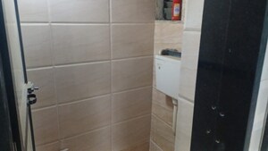 Bathroom in 1 BHK Apartment at Raunak Unnathi Greens, Kasarvadavali – for Sale