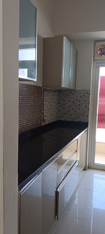 Kitchen in 2 BHK Apartment at Omkar Alta Monte, Malad East – for Sale