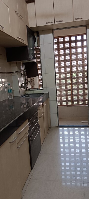 Kitchen in 2 BHK Apartment at Riddhi Garden, Malad East – for Rent