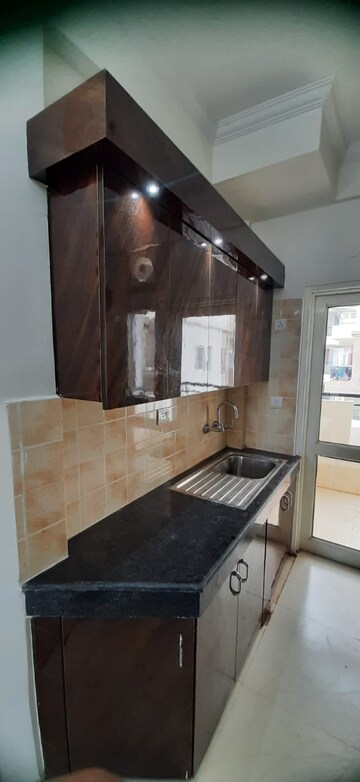 Kitchen in 2 BHK Apartment at Ramprastha Awho, Sector 95 – for Rent