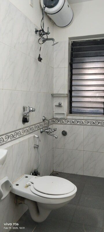 Bathroom in 3 BHK Apartment at Palm Springs, Malad West – for Rent