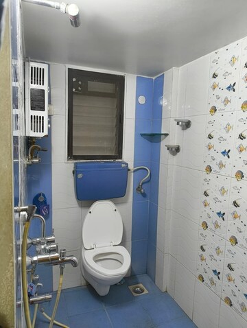 Bathroom in 2 BHK Apartment at Gokul Garden CHS, Kandivali East – for Rent