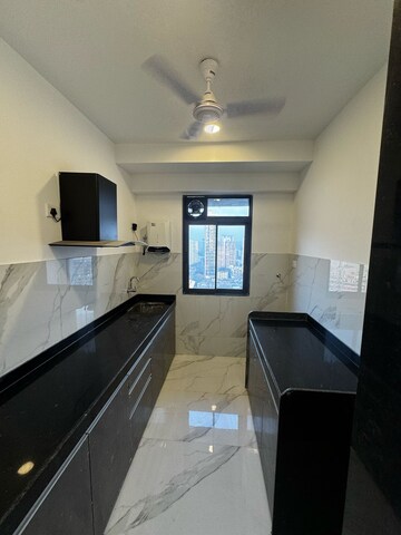 Kitchen in 2 BHK Apartment at Dev Leo Tower, Oshiwara – for Rent