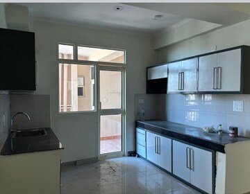 Kitchen in 3.5 BHK Apartment at JKG Palm Court, Sector 16c Greater Noida – for Rent