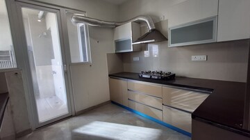 Kitchen in 4 BHK Apartment at Artique Uptown Skylla, International Airport Road – for Rent