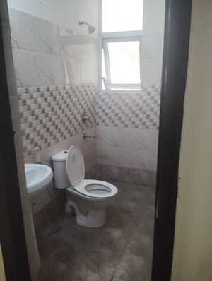 Bathroom in 3 BHK Builder Floor at Krish Aura, Alwar Bypass Road – for Sale