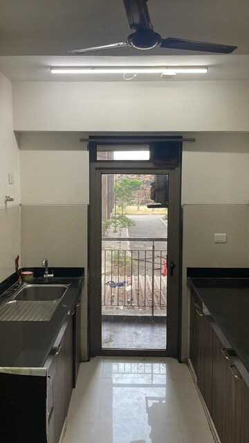 Kitchen in 1.5 BHK Apartment at Lodha Splendora Phase II, Ghodbunder Road – for Sale