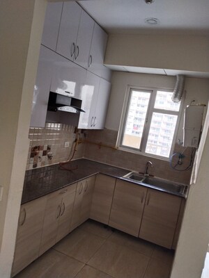 Kitchen in 3 BHK Apartment at Amrapali Golf Homes, Sector 4, Greater Noida – for Sale