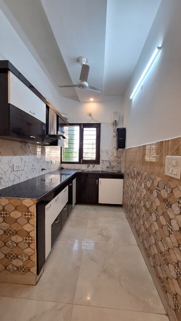 Kitchen in 3 BHK Builder Floor at Dhakoli Village – for Sale