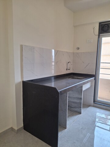 Kitchen in 1 BHK Apartment at Damji Shamji Kalpvruksha Tulip, Kasarvadavali – for Rent