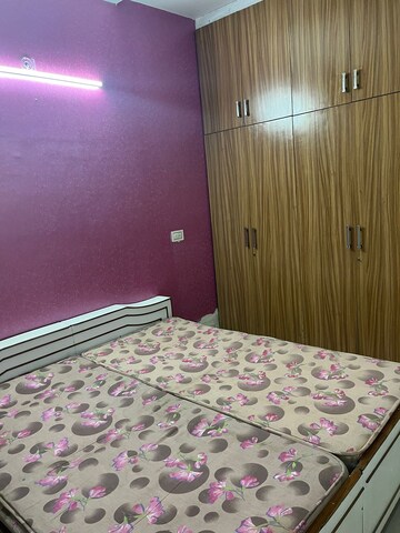 Bedroom in 2 BHK Builder Floor at Guru Nanak Enclave, Dhakoli Village – for Rent