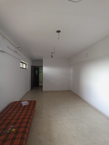 Living Room in 1 BHK Apartment at Lodha Lakeshore Greens, Dombivli East – for Sale