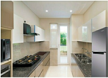 Kitchen in 3 BHK Apartment at Motia Blue Ridge, Dhakoli Village – for Sale