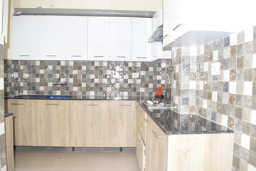 Kitchen in 4 BHK Builder Floor at Ansal API Esencia, Sector 67 – for Rent