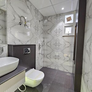 Bathroom in 3 BHK Apartment at Dhakoli Village – for Sale