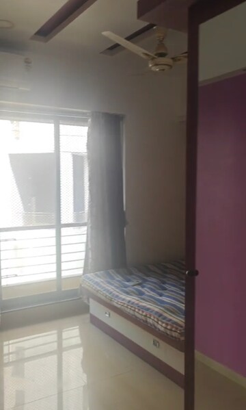 Master Bedroom in 2 BHK Apartment at Lalani Residency, Kavesar – for Rent