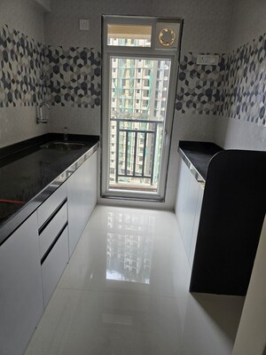 Kitchen in 1 BHK Apartment at Raunak Bliss, Ghodbunder Road – for Sale