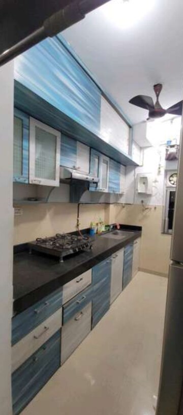 Kitchen in 2 BHK Apartment at Kalpataru Hills Phase II, Manpada – for Rent