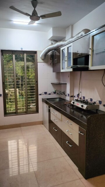 Kitchen in 2 BHK Apartment at Gulmohar Upvan CHS, Gawand Baug – for Rent