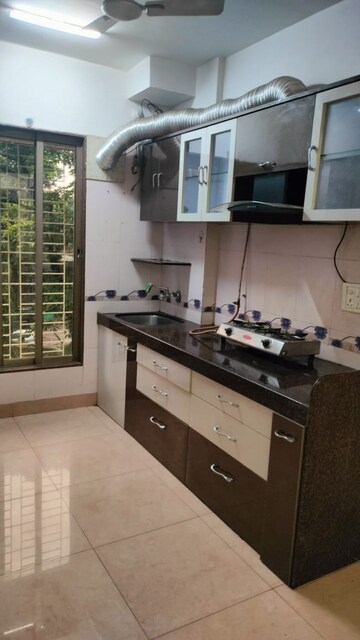Kitchen in 2 BHK Apartment at Gulmohar Upvan CHS, Gawand Baug – for Rent