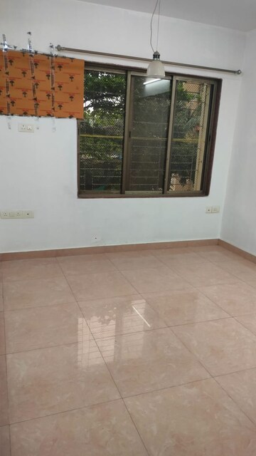 Master Bedroom in 2 BHK Apartment at Gulmohar Upvan CHS, Gawand Baug – for Rent