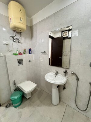 Bathroom in 3 BHK Builder Floor at Nehru Enclave – for Sale