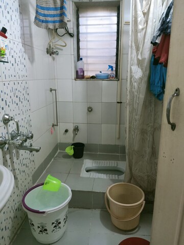 Bathroom in 2 BHK Apartment at Nagari Niwara CHS, Goregaon East – for Rent