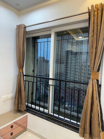 Living Room in 2 BHK Apartment at Rustomjee Urbania Azziano, Majiwada – for Rent