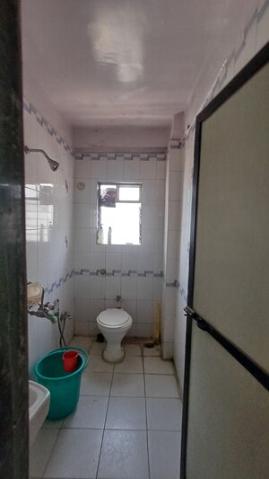 Bathroom in 2 BHK Apartment at Arihant Plaza CHS, Owale – for Sale