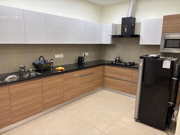 Kitchen in 3 BHK Apartment at Maya Green Lotus Utsav, International Airport Road – for Rent