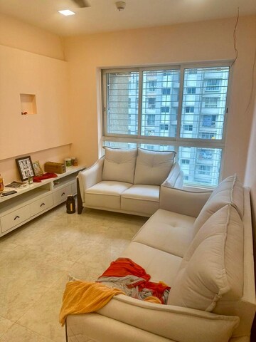 Living Room in 2 BHK Apartment at Lodha Amara, Kolshet Road – for Sale