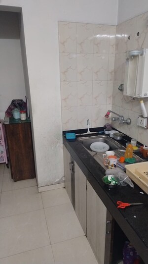 Kitchen in 2 BHK Apartment at Dorabjee Enclave, Salunkhe Vihar Society – for Sale