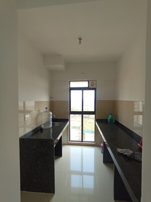 Kitchen in 1 BHK Apartment at Lodha Palava Downtown, Dombivli East – for Sale