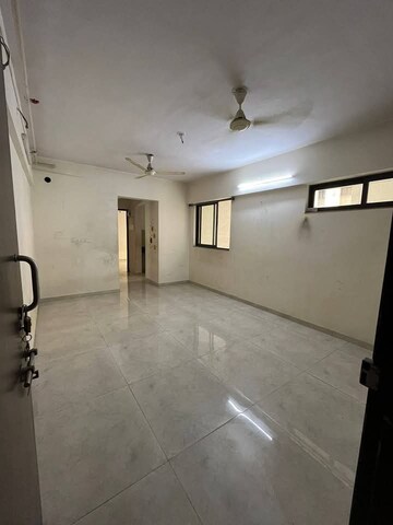 Living Room in 1 BHK Apartment at Lodha Lakeshore Greens, Dombivli East – for Rent