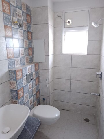 Bathroom in 1.5 BHK Apartment at Paradigm Business Hermitage Park, Dhakoli Village – for Rent
