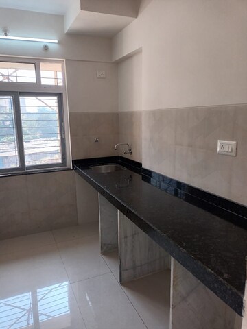 Kitchen in 2 BHK Apartment at Charms Global City, Ambernath East – for Sale