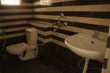 Bathroom in 3 BHK Builder Floor at Bangur Avenue – for Sale